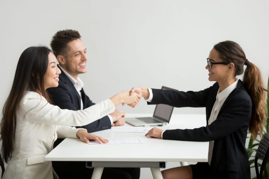 Lady congratulating a candidate after an interview